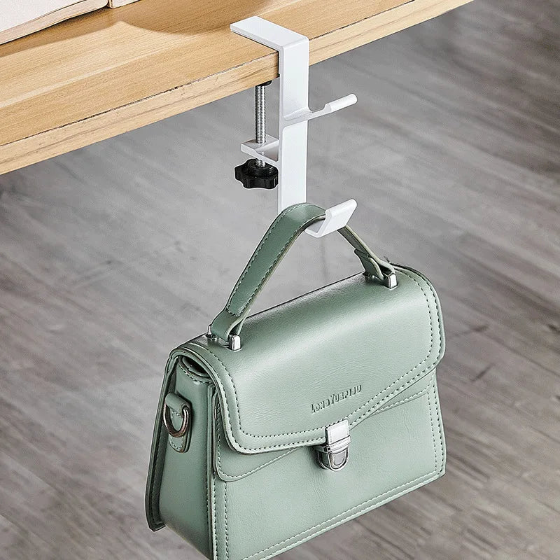 Gancho Ajustável – Mais espaço e praticidade na sua mesa.